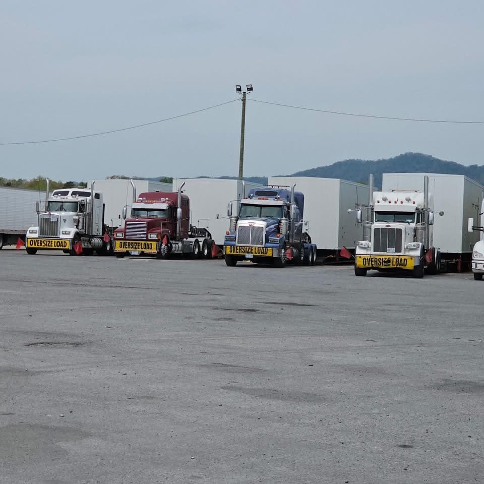 Stein & Sons trucks staged with oversize modular enclosure loads