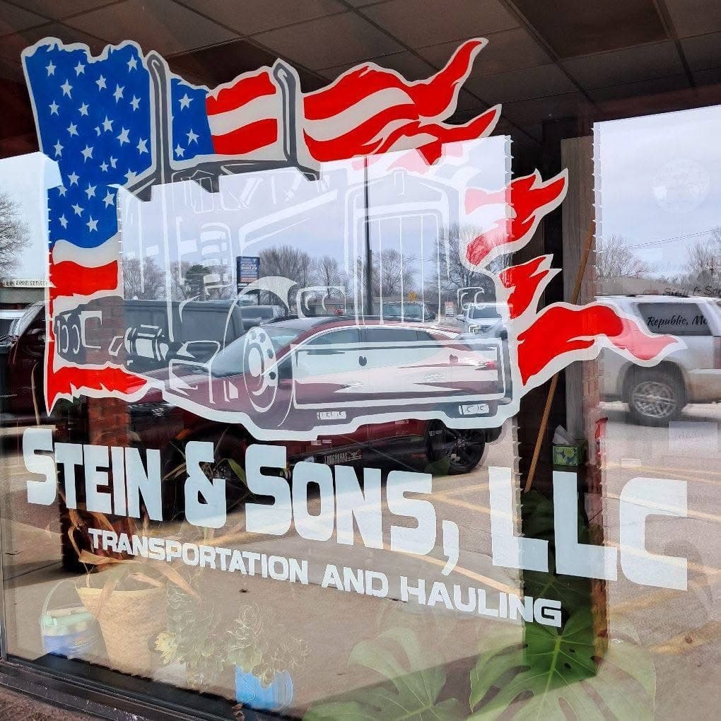 Stein & Sons Transportation and Hauling logo at the company office